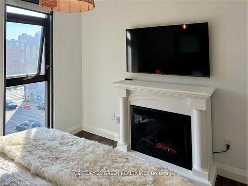 417-118 King Street E, Hamilton, ON - Indoor Photo Showing Living Room With Fireplace