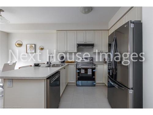 12-8317 Mulberry Drive, Niagara Falls, ON - Indoor Photo Showing Kitchen With Double Sink