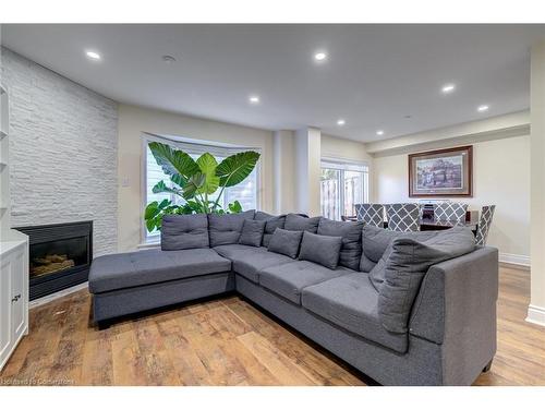 19-2880 Headon Forest Drive, Burlington, ON - Indoor Photo Showing Living Room With Fireplace