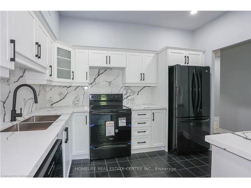 117-8111 Forest Glen Drive, Niagara Falls, ON - Indoor Photo Showing Kitchen With Double Sink