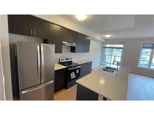 610-585 Colborne Street E, Brantford, ON - Indoor Photo Showing Kitchen With Stainless Steel Kitchen With Double Sink