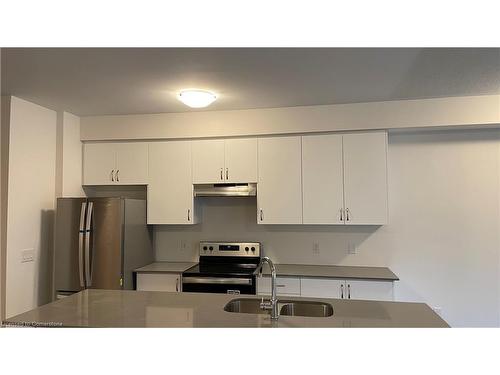 712-585 Colborne Street E, Brantford, ON - Indoor Photo Showing Kitchen With Stainless Steel Kitchen With Double Sink