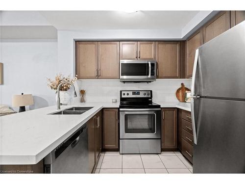 203-650 Sauve Street, Milton, ON - Indoor Photo Showing Kitchen With Stainless Steel Kitchen With Double Sink With Upgraded Kitchen