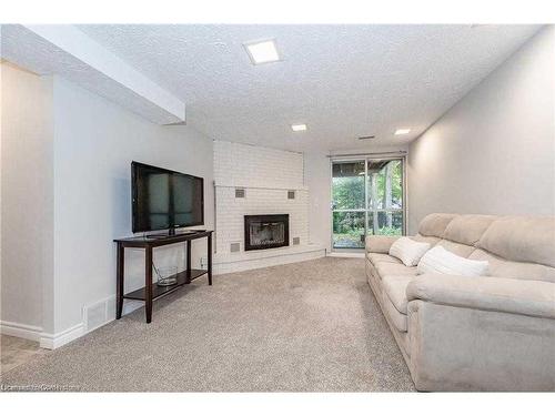 Upper-604 Glen Forrest Boulevard, Waterloo, ON - Indoor Photo Showing Living Room With Fireplace