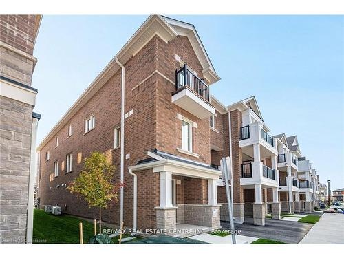 75-1317 Leriche Way, Milton, ON - Outdoor With Balcony With Facade