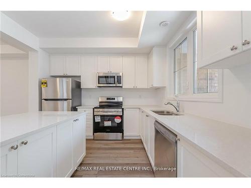 75-1317 Leriche Way, Milton, ON - Indoor Photo Showing Kitchen With Stainless Steel Kitchen With Double Sink With Upgraded Kitchen