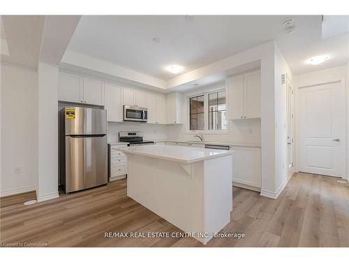 75-1317 Leriche Way, Milton, ON - Indoor Photo Showing Kitchen With Stainless Steel Kitchen With Upgraded Kitchen