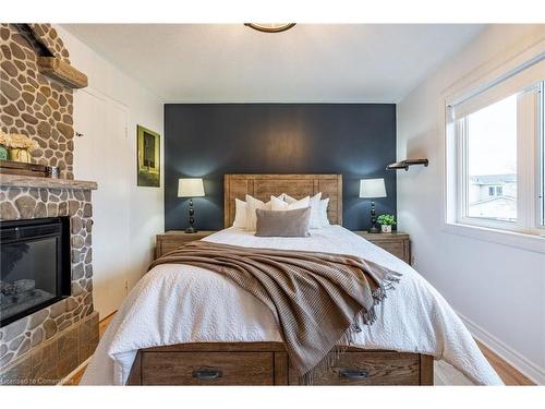 34 Corey Circle, Georgetown, ON - Indoor Photo Showing Bedroom With Fireplace