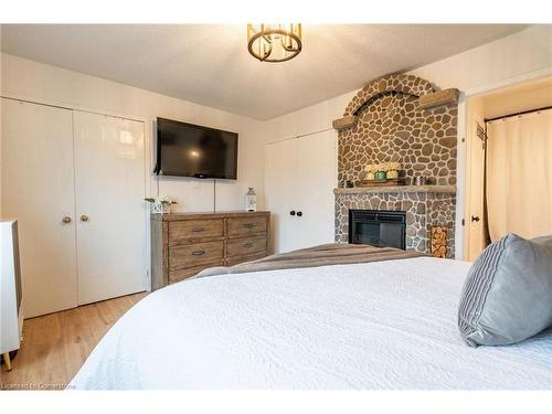 34 Corey Circle, Georgetown, ON - Indoor Photo Showing Bedroom With Fireplace