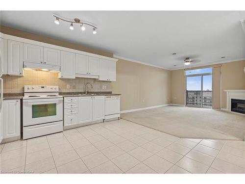 1001-353 Commissioners Road W, London, ON - Indoor Photo Showing Kitchen With Fireplace