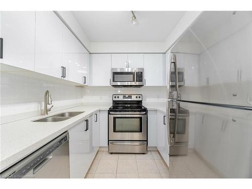 304-4879 Kimbermount Avenue, Mississauga, ON - Indoor Photo Showing Kitchen With Stainless Steel Kitchen With Double Sink