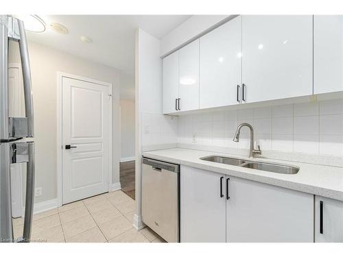 304-4879 Kimbermount Avenue, Mississauga, ON - Indoor Photo Showing Kitchen With Double Sink