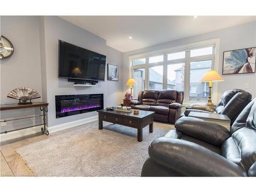 18-9245 Shoveller Avenue, Niagara Falls, ON - Indoor Photo Showing Living Room With Fireplace