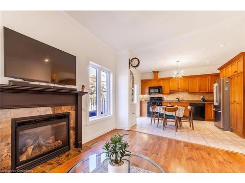 7-310 Southbrook Drive, Binbrook, ON - Indoor Photo Showing Living Room With Fireplace