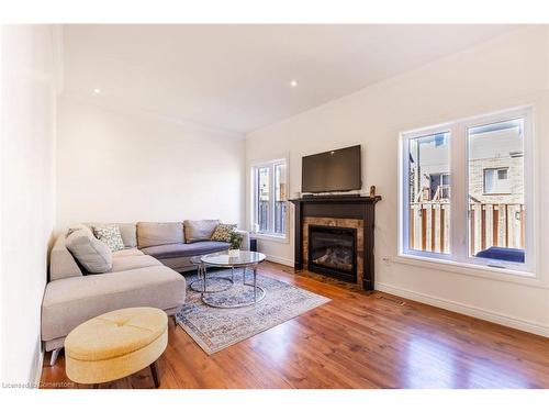 7-310 Southbrook Drive, Binbrook, ON - Indoor Photo Showing Living Room With Fireplace