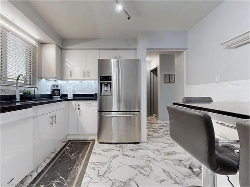 7086 Centennial Street, Niagara Falls, ON - Indoor Photo Showing Kitchen With Double Sink