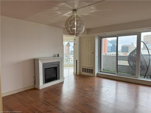 901-67 Caroline Street S, Hamilton, ON - Indoor Photo Showing Living Room With Fireplace