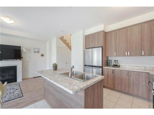 23 Povey Road, Fergus, ON - Indoor Photo Showing Kitchen With Fireplace With Double Sink