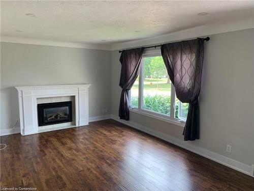 Main-24 Manor Road, St. Catharines, ON - Indoor Photo Showing Living Room With Fireplace