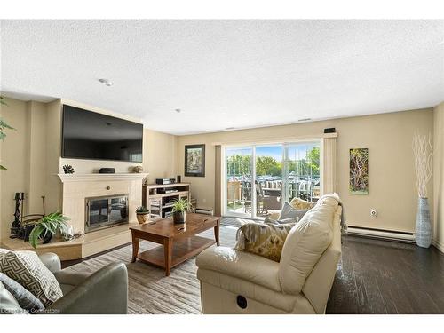 W-9-1500 Venetian Boulevard, Sarnia, ON - Indoor Photo Showing Living Room With Fireplace