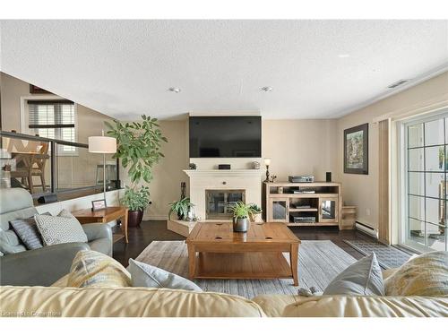 W-9-1500 Venetian Boulevard, Sarnia, ON - Indoor Photo Showing Living Room With Fireplace