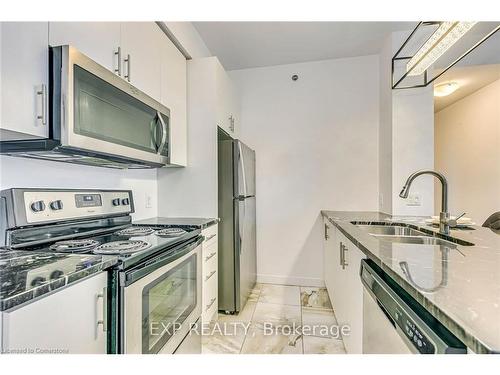 403-2490 Old Bronte Road, Oakville, ON - Indoor Photo Showing Kitchen With Stainless Steel Kitchen With Double Sink With Upgraded Kitchen