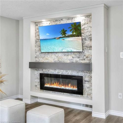 Upper-608 Woolgrass Avenue, Waterloo, ON - Indoor Photo Showing Living Room With Fireplace