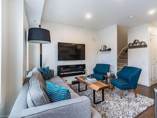 14-93 The Queensway Way, Toronto, ON - Indoor Photo Showing Living Room With Fireplace