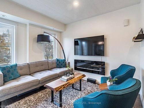 14-93 The Queensway Way, Toronto, ON - Indoor Photo Showing Living Room With Fireplace