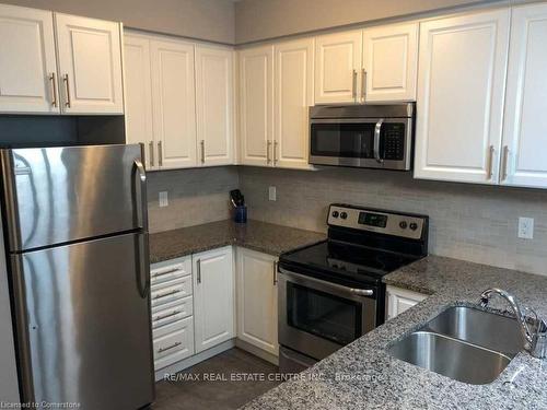 208-263 Georgian Drive, Oakville, ON - Indoor Photo Showing Kitchen With Stainless Steel Kitchen With Double Sink