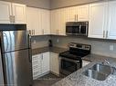 208-263 Georgian Drive, Oakville, ON  - Indoor Photo Showing Kitchen With Stainless Steel Kitchen With Double Sink 