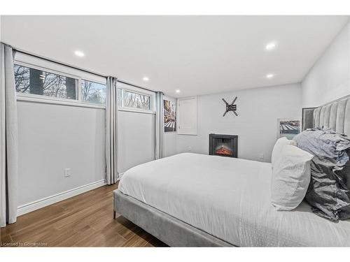 2401 St Frances Drive, Burlington, ON - Indoor Photo Showing Bedroom With Fireplace