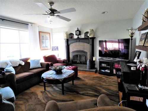209 - 67325 Churchill Road, Lac La Biche, AB - Indoor Photo Showing Living Room With Fireplace