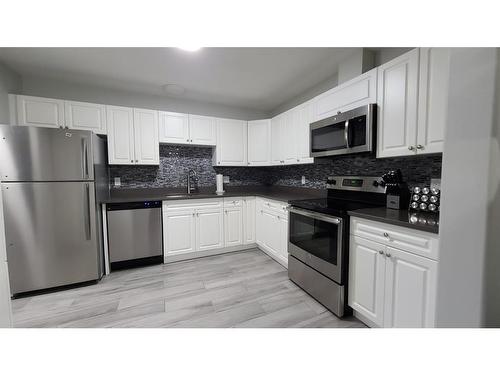 302-9508 99 Street, Lac La Biche, AB - Indoor Photo Showing Kitchen With Stainless Steel Kitchen With Double Sink