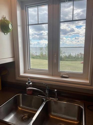 9 Moonlight Bay, Lac La Biche, AB - Indoor Photo Showing Kitchen With Double Sink
