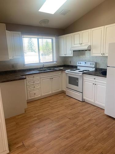 9202 94 Avenue, Lac La Biche, AB - Indoor Photo Showing Kitchen With Double Sink