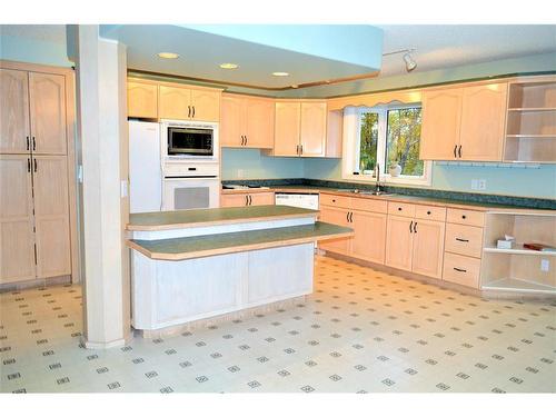 67425 Mission Road, Lac La Biche, AB - Indoor Photo Showing Kitchen With Double Sink