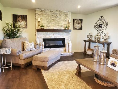16303 Birch Grove Road, Plamondon, AB - Indoor Photo Showing Living Room With Fireplace