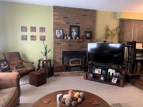10016 102 Avenue, Lac La Biche, AB - Indoor Photo Showing Living Room With Fireplace