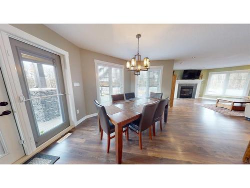 65335-153 Range Rd., Lac La Biche, AB - Indoor Photo Showing Dining Room With Fireplace