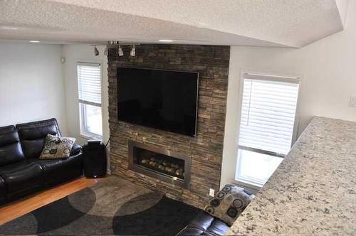 150 Laura'S Spruce Drive, Lac La Biche, AB - Indoor Photo Showing Living Room With Fireplace