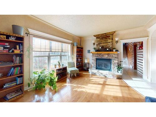 3105 Park Avenue, Mallaig, AB - Indoor Photo Showing Living Room With Fireplace