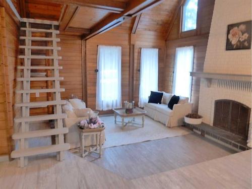 206-13441 665A Township, Lac La Biche, AB - Indoor Photo Showing Living Room With Fireplace