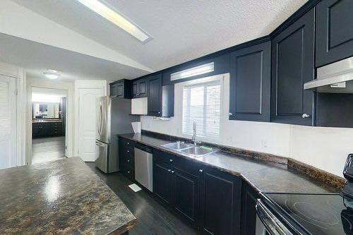100 Arabian Drive, Fort Mcmurray, AB - Indoor Photo Showing Kitchen With Double Sink