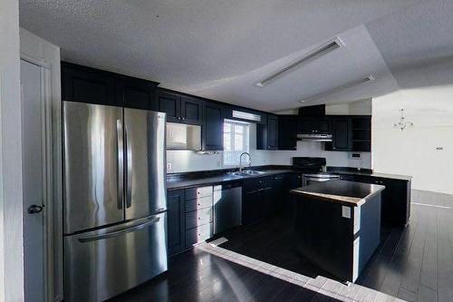 100 Arabian Drive, Fort Mcmurray, AB - Indoor Photo Showing Kitchen With Double Sink