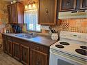 68135 881 Highway, Lac La Biche, AB  - Indoor Photo Showing Kitchen With Double Sink 