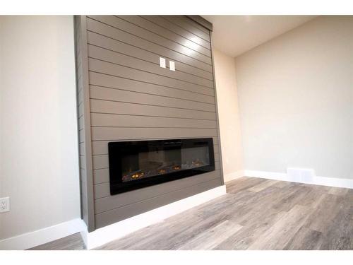 144 Manchester Way Nw, Fort Mcmurray, AB - Indoor Photo Showing Living Room With Fireplace