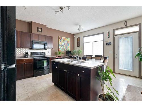 285 Grosbeak Way, Fort Mcmurray, AB - Indoor Photo Showing Kitchen With Double Sink