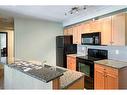 201-118 Millennium Drive, Fort Mcmurray, AB  - Indoor Photo Showing Kitchen With Double Sink 