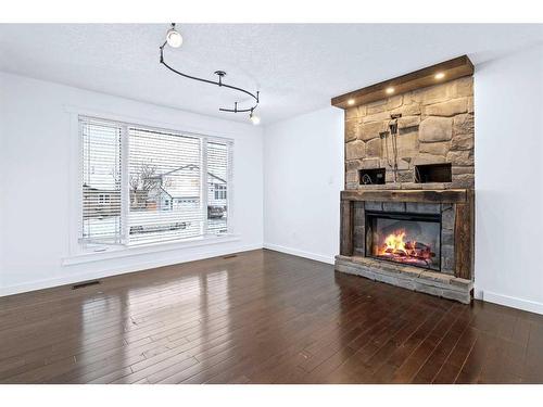 122 Leigh Crescent, Fort Mcmurray, AB - Indoor Photo Showing Living Room With Fireplace